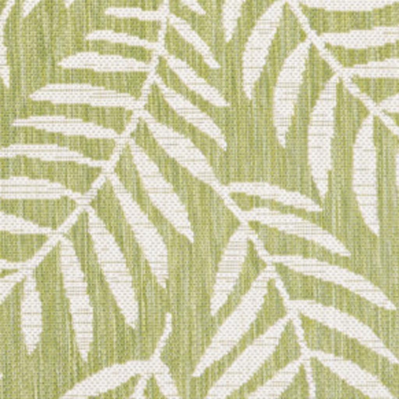 Green and cream indoor/outdoor rug close-up of leaf and striped motif