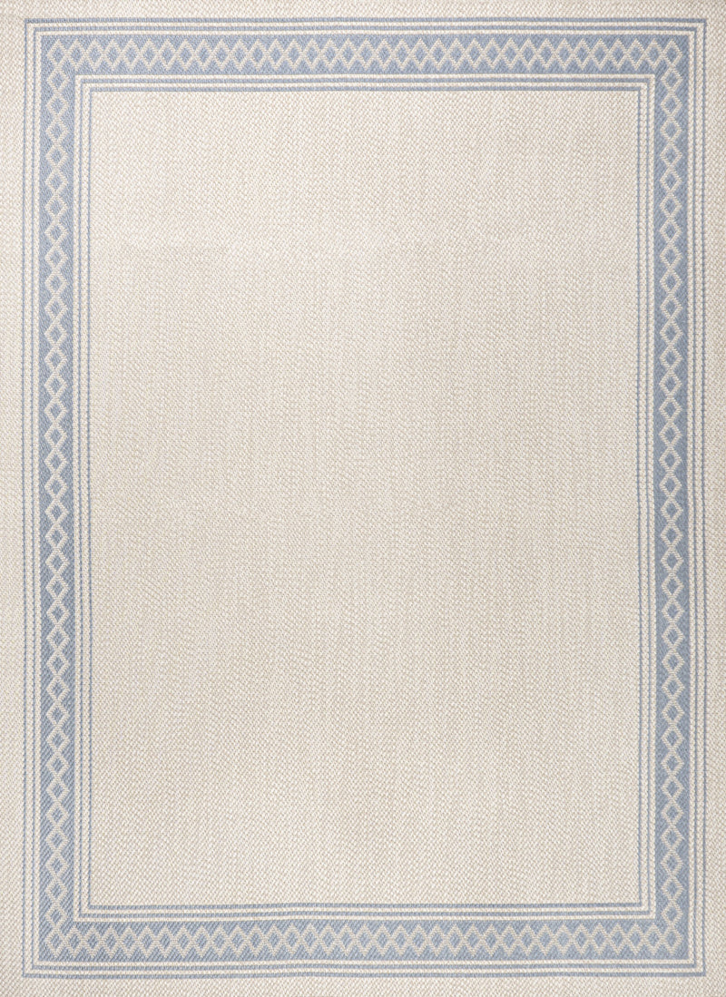 Cream rug texture with blue border and diamond-pattern trim