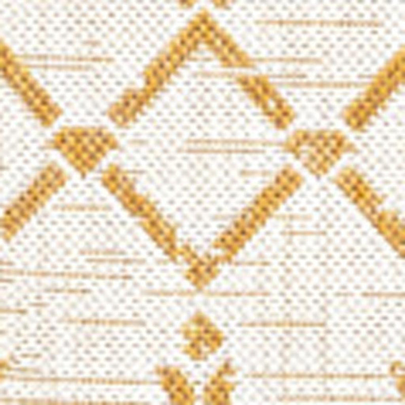 Close-up of cream area rug with yellow trellis diamond lattice pattern