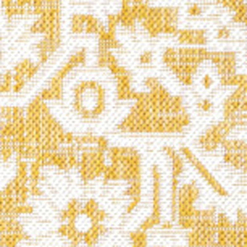 Close-up of yellow and cream rug pattern with interlocking geometric motifs
