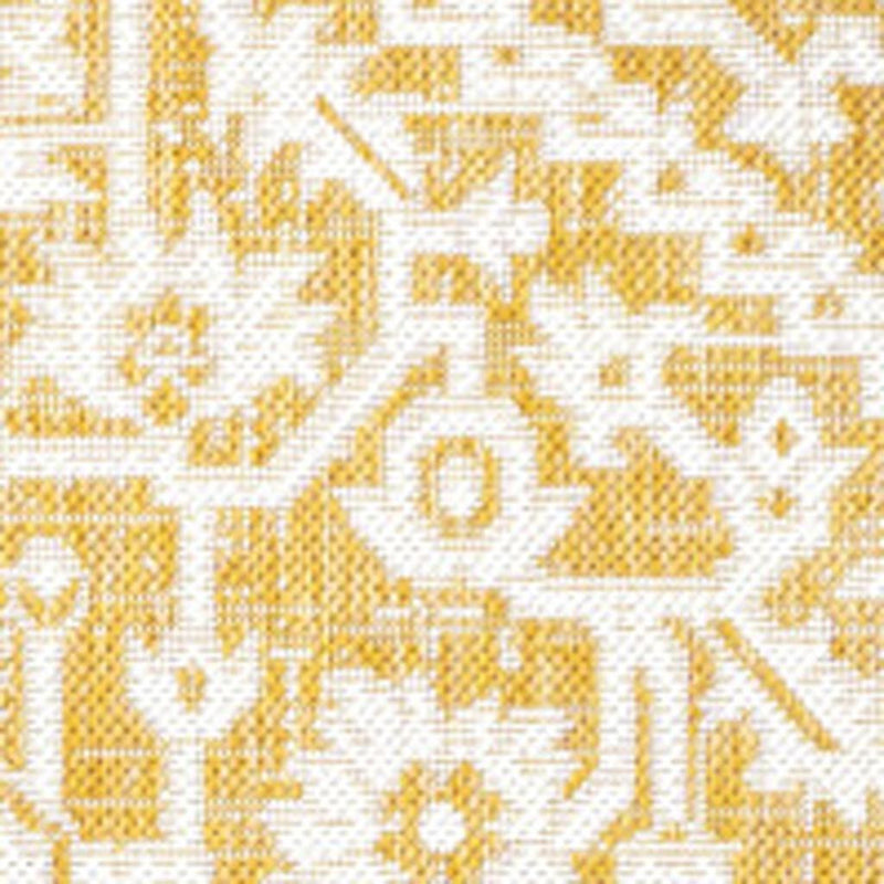 Close-up of yellow and cream medallion rug design with textured geometric shapes