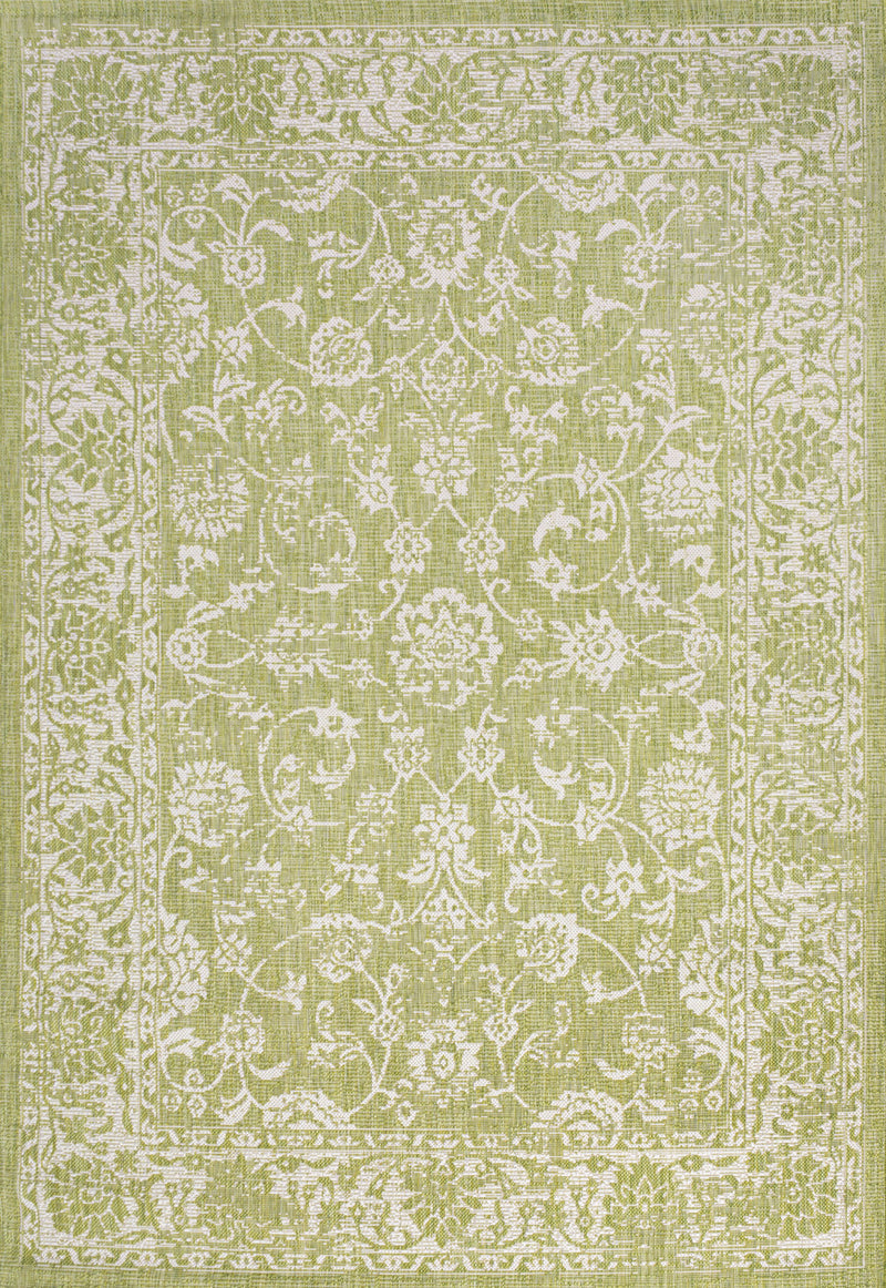 Green and cream medallion area rug with ornate white pattern and border