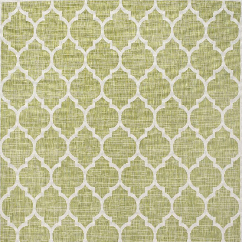 Green and cream geometric area rug pattern close-up