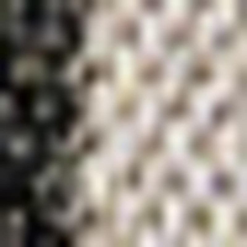 Striped area rug with alternating dark and beige vertical bands, close-up