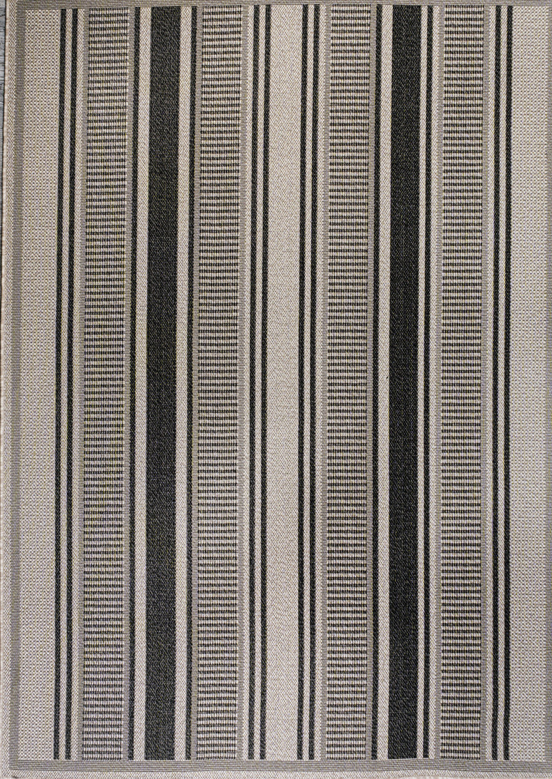 Close-up of vertically striped area rug in black, beige, and light gray
