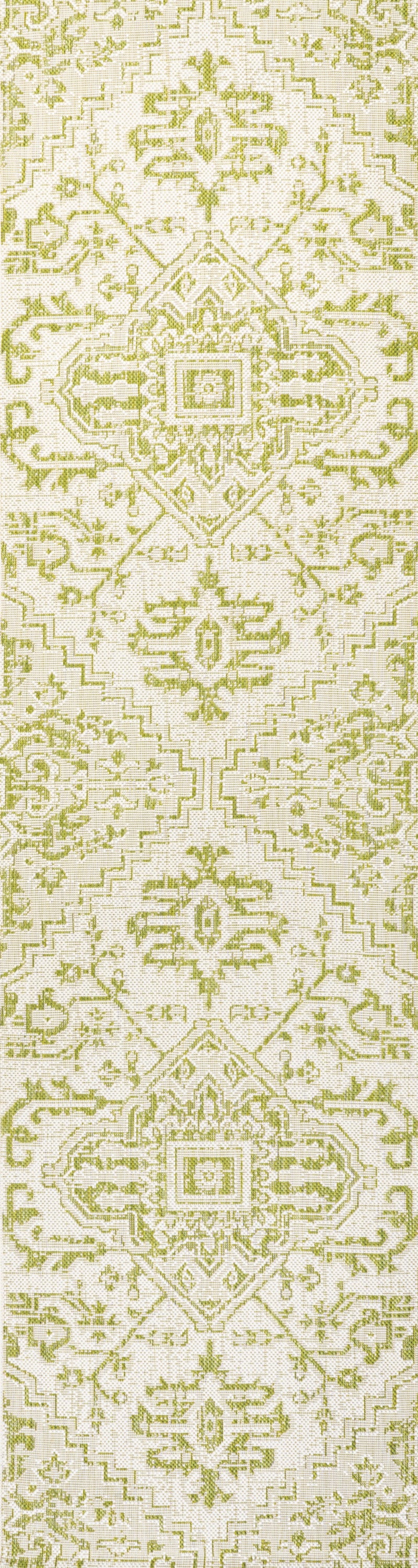 Cream and green medallion patterned runner rug with repeating geometric motifs