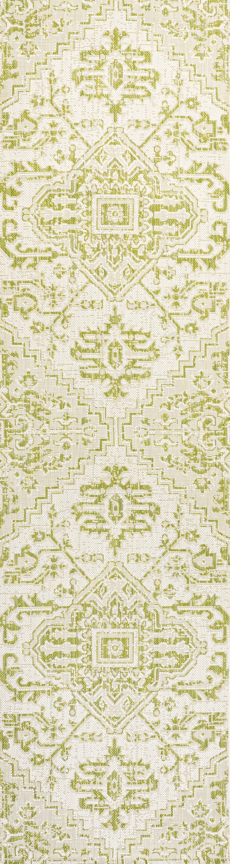 Cream and green medallion medallion-style rug pattern, repeating textured motifs