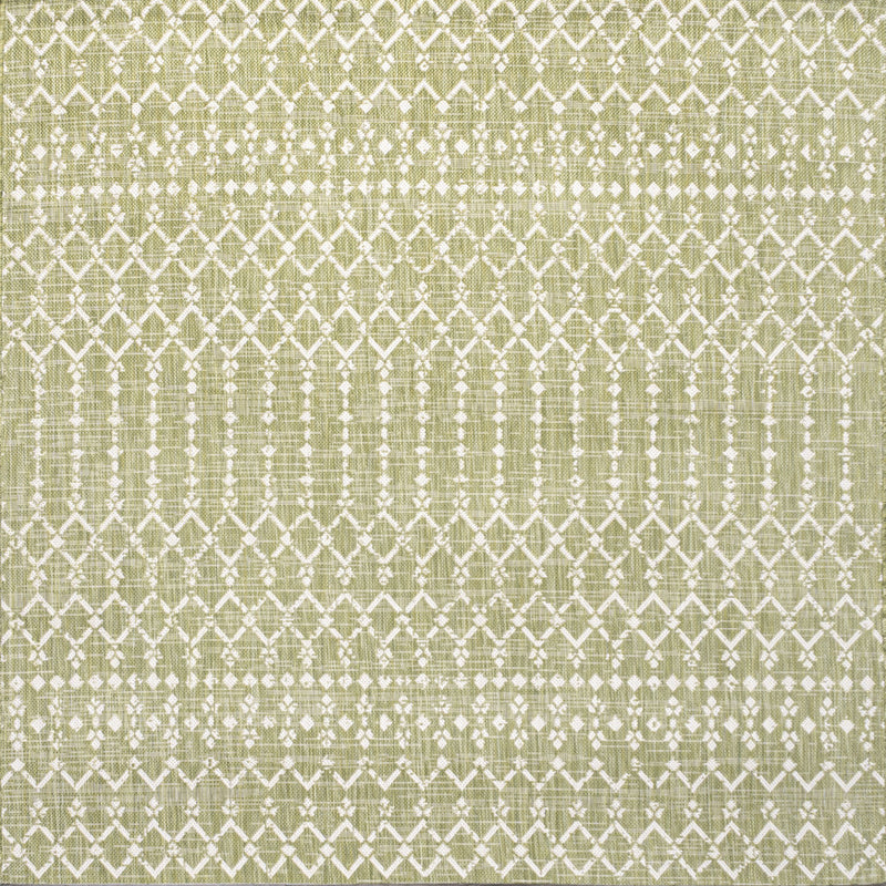 Light green area rug featuring cream square trellis and lattice detailing