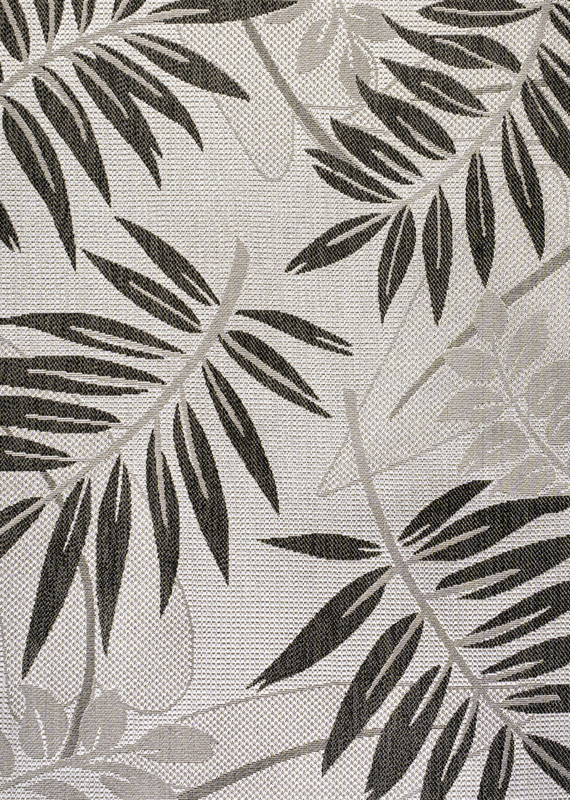 Light gray area rug with dark gray leaf floral pattern, textured weave