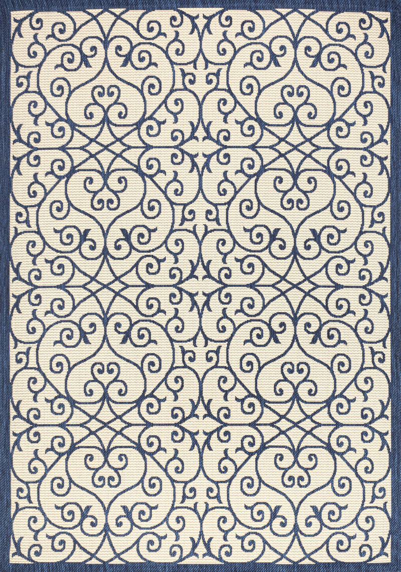 Geometric scroll area rug in navy and beige, textured close-up