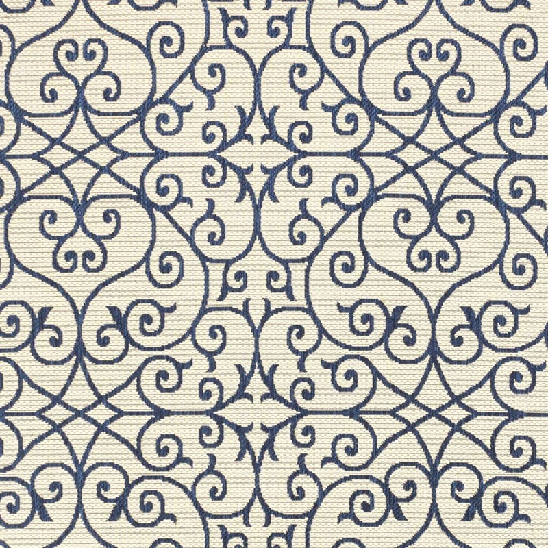 Navy and beige geometric scroll area rug pattern close-up
