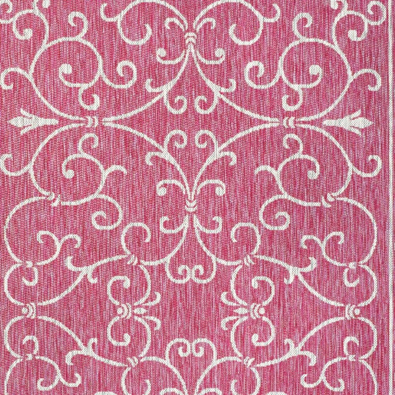 Fuchsia rug with close-up light gray ornate scrollwork pattern
