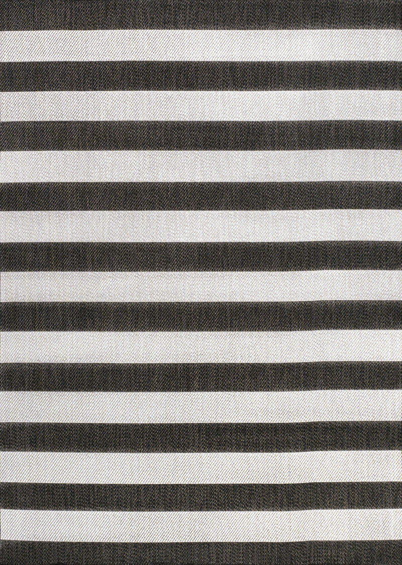Close-up of black and cream striped area rug with textured woven fabric