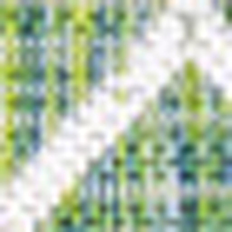 Diagonal section of green trellis area rug with cream diamond lattice pattern