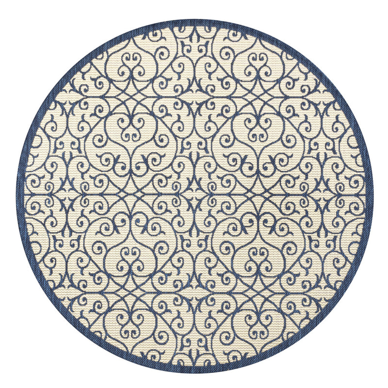 Round rug with navy medallion scroll pattern on beige background
