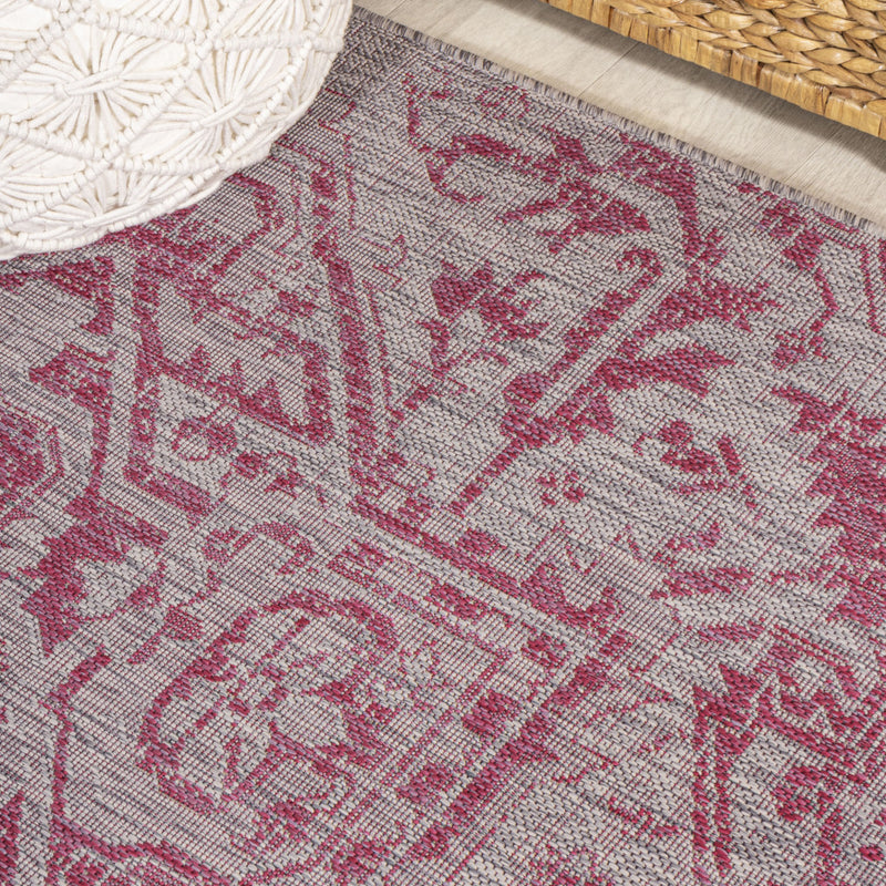 Fuchsia and light gray medallion area rug with intricate ornamental linework