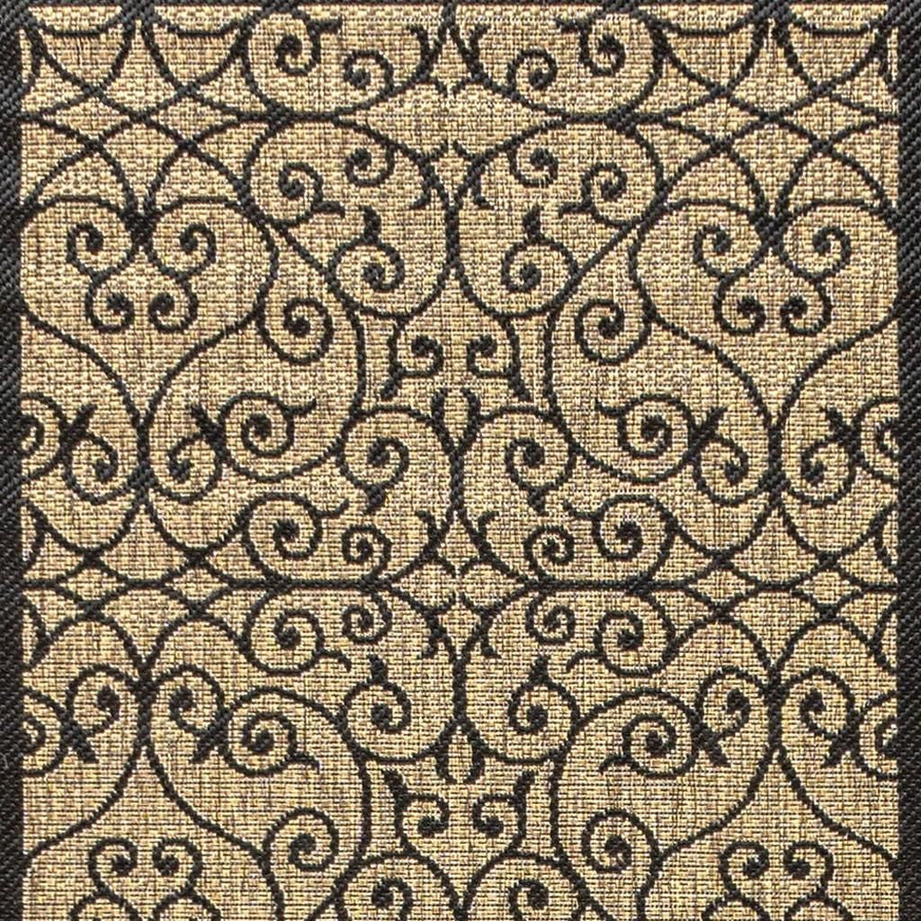 Indoor/outdoor runner rug with black geometric scroll pattern on khaki background
