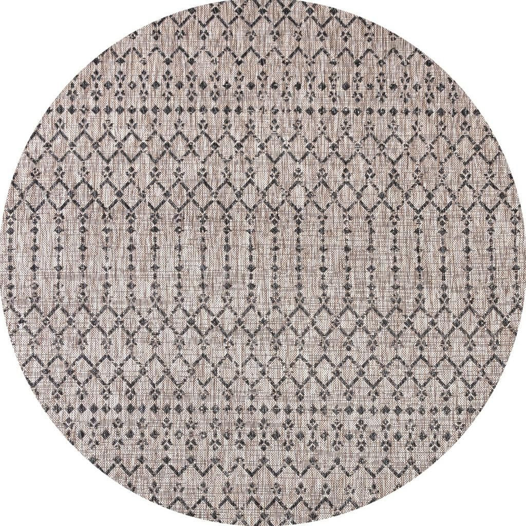 Round beige indoor/outdoor area rug with black trellis diamond lattice pattern.