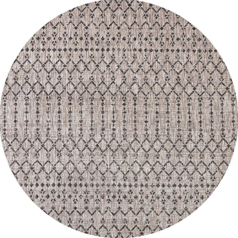 Round beige indoor/outdoor area rug with black trellis diamond lattice pattern.