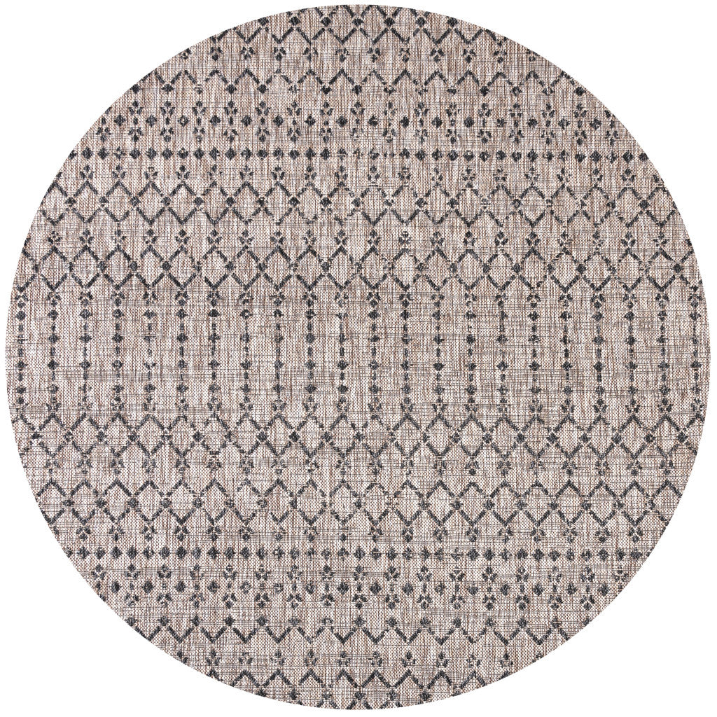 Beige round rug with black trellis diamond rows; full pattern view.