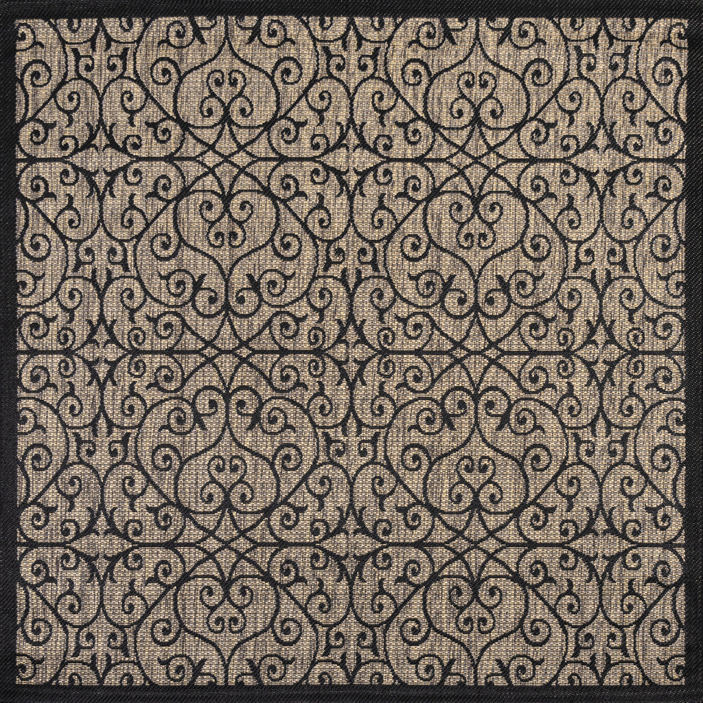 Geometric indoor outdoor area rug with ornate scroll pattern in dark and beige tones