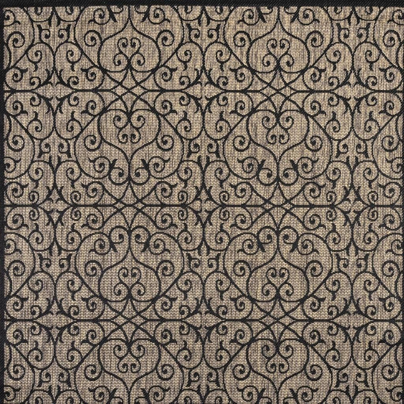 Black-and-khaki patterned area rug with intricate swirling medallion design