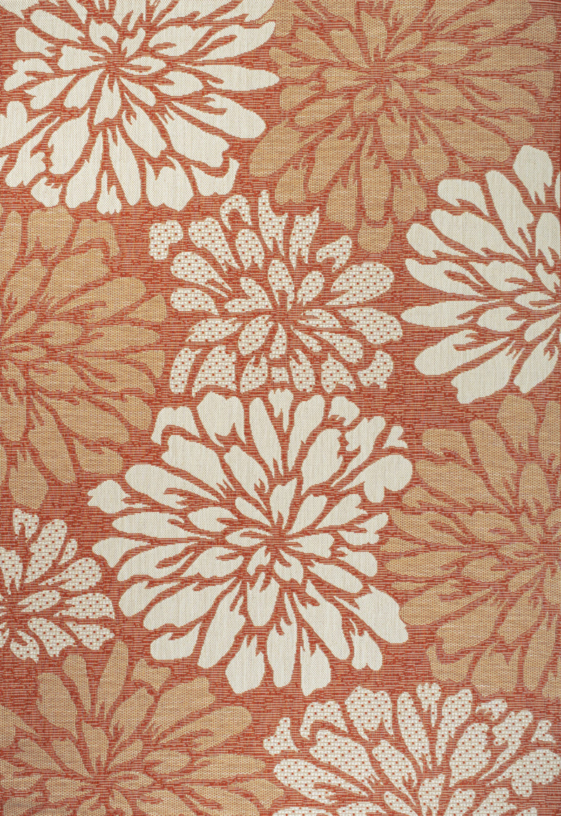 Orange and cream floral area rug close-up of red-orange and cream flower bursts