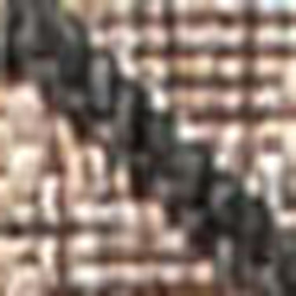 Close-up of natural and black trellis pattern runner rug texture.