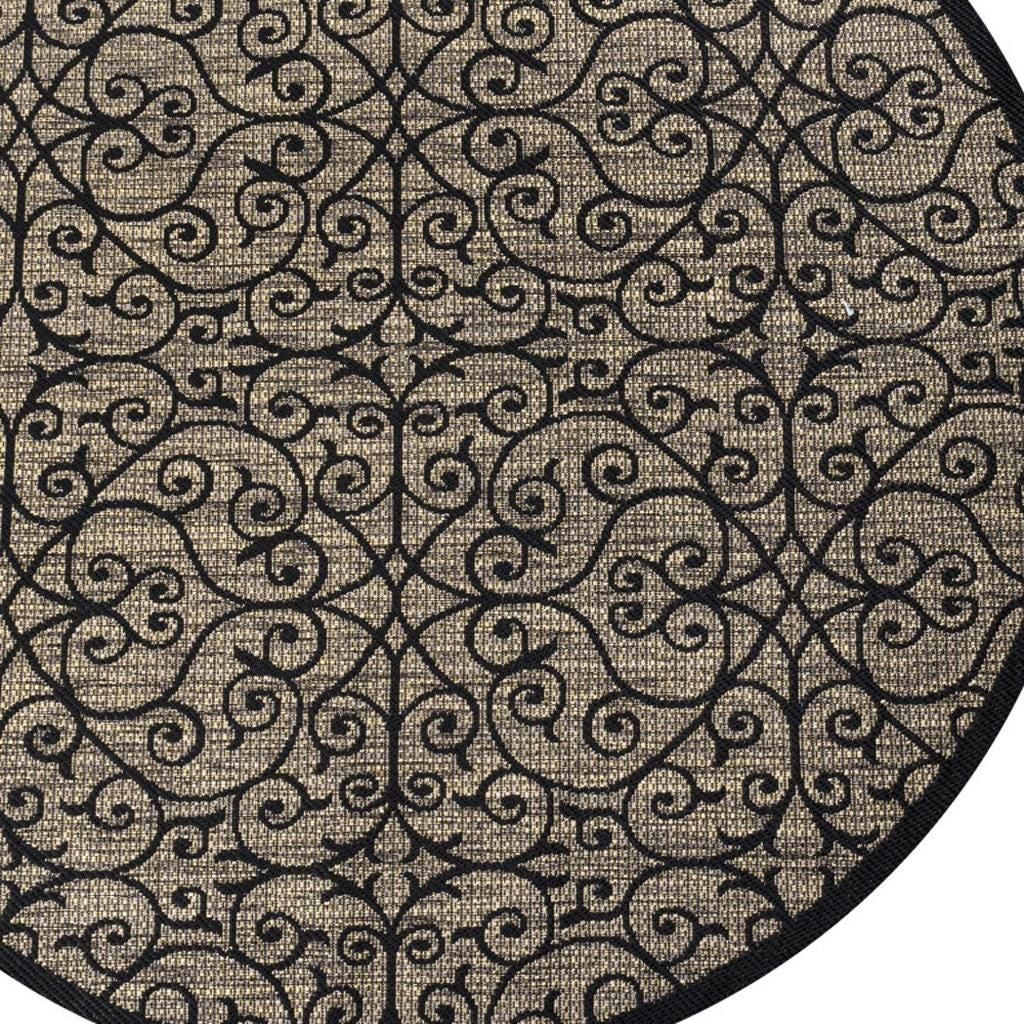 Round rug with dark border and khaki swirls forming a geometric lattice pattern