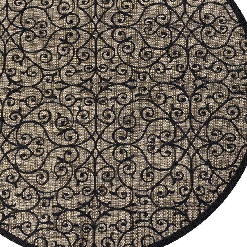 Round rug with dark border and khaki swirls forming a geometric lattice pattern