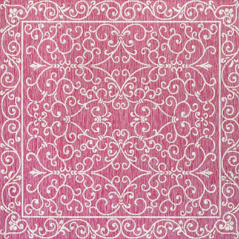 Square fuchsia rug with white floral scroll medallions in center and framed border