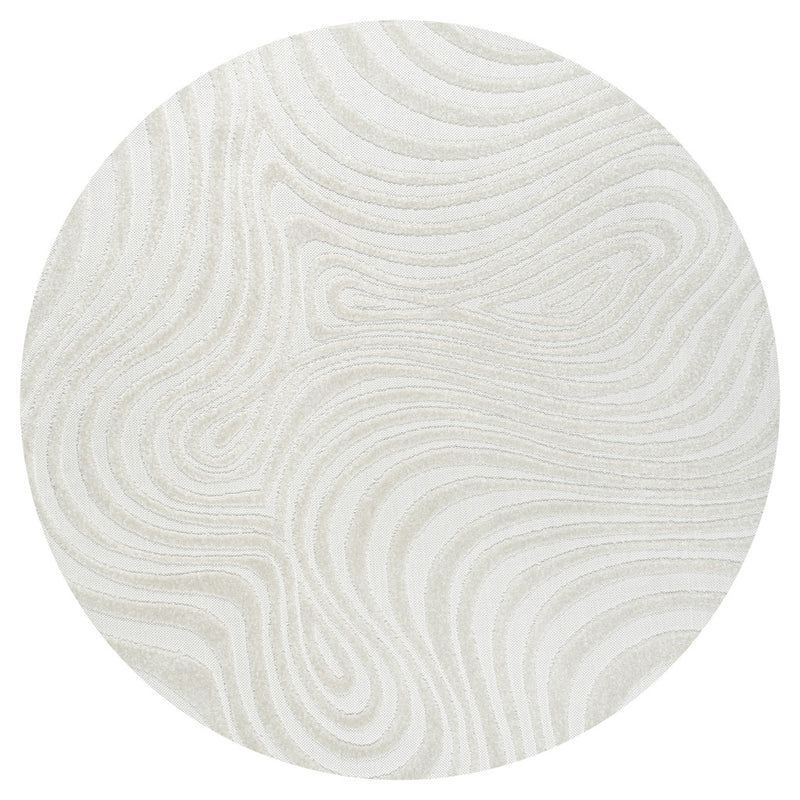 Cream ivory round area rug with abstract concentric wave pattern.
