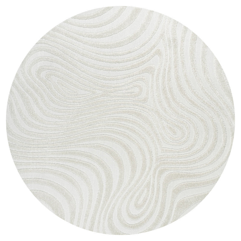 Round cream and ivory area rug with flowing abstract wavy lines design.