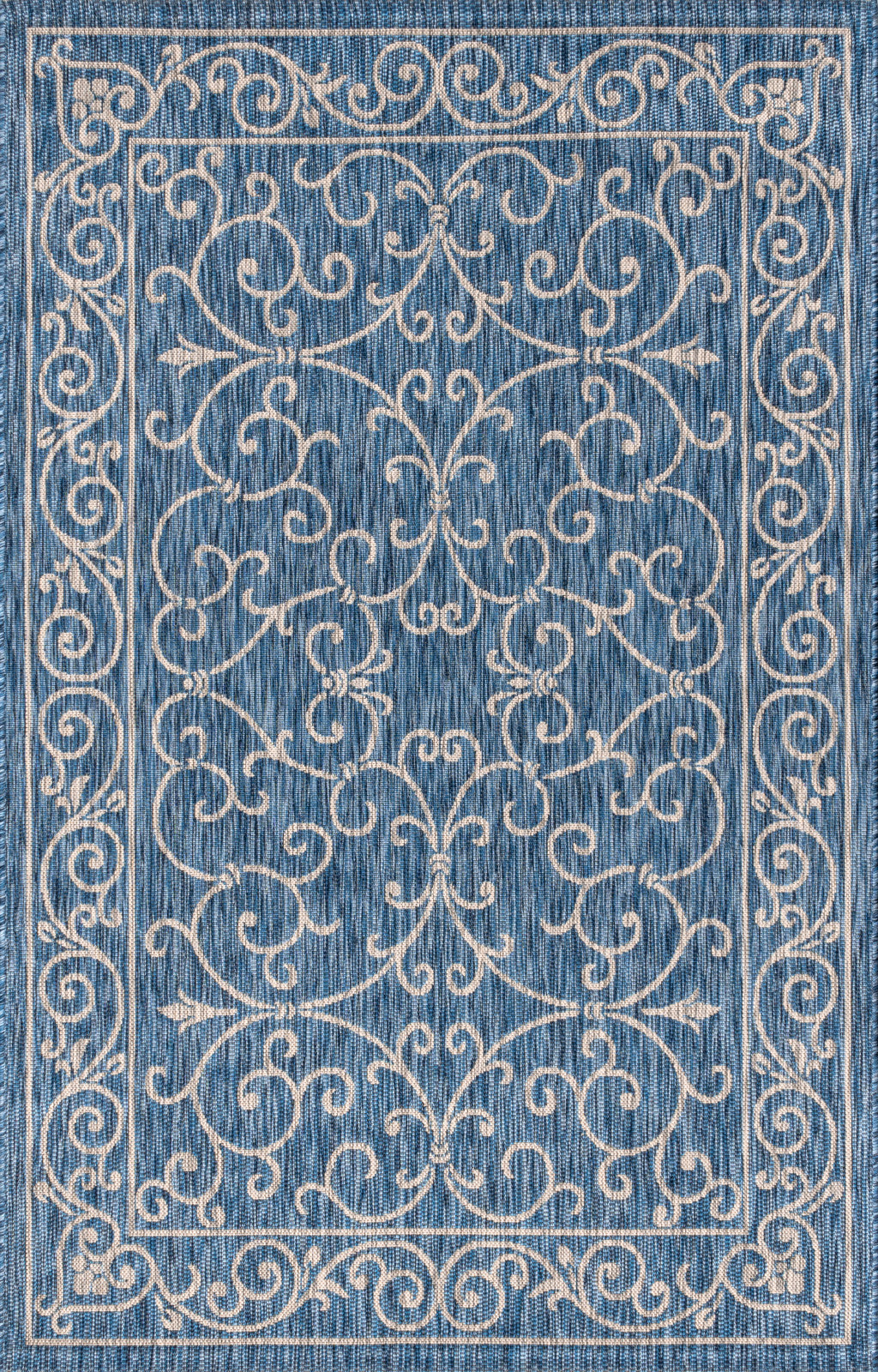 Navy blue area rug with gray ornate medallion and scrollwork pattern