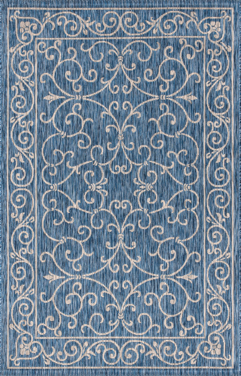 Navy blue area rug with gray ornate medallion and scrollwork pattern