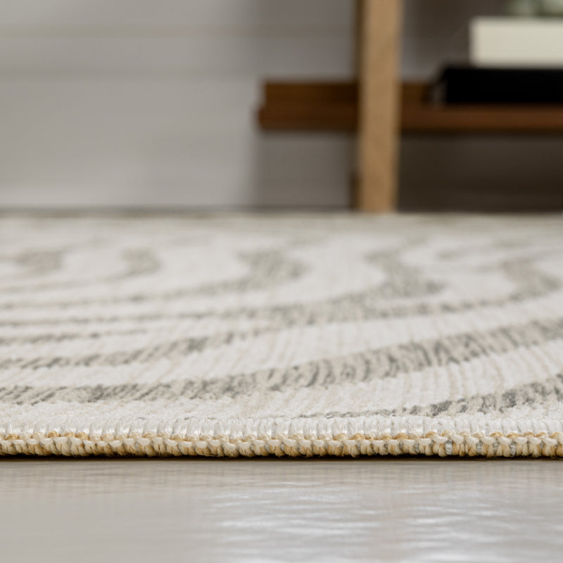 Gray and cream abstract indoor/outdoor runner rug with flat weave and woven edge border