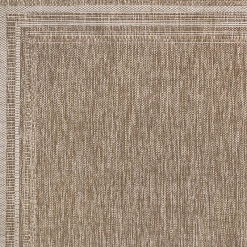 Beige and cream area rug close-up texture with thin border lines around the edges