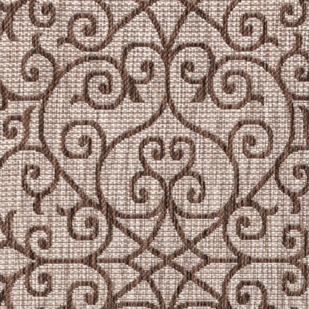 Close-up taupe and espresso geometric rug texture with swirling ornamental pattern