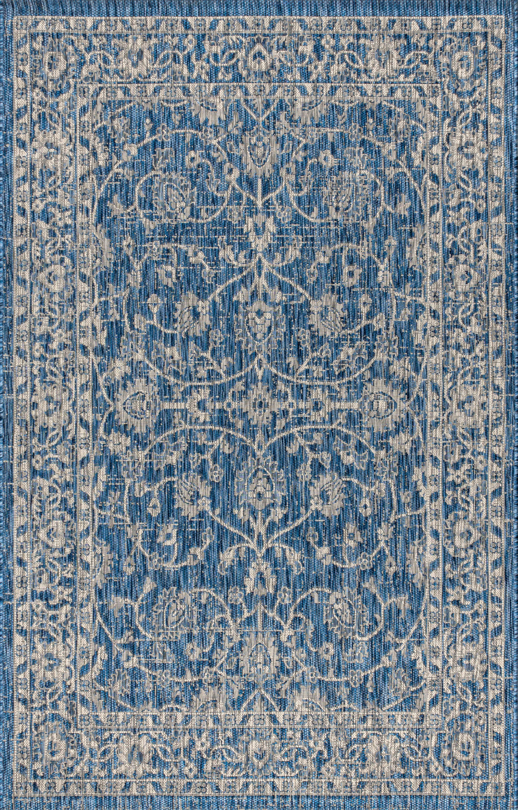 Close-up of navy and gray medallion area rug with intricate damask-style motif
