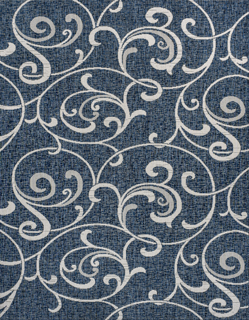 Navy blue rug with cream ornate floral scrolls, dense repeating pattern