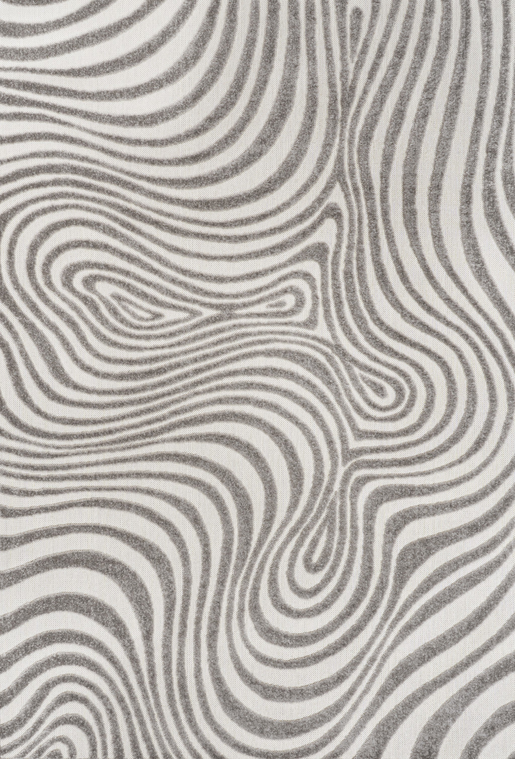 Close-up abstract area rug with gray and ivory wavy contour lines