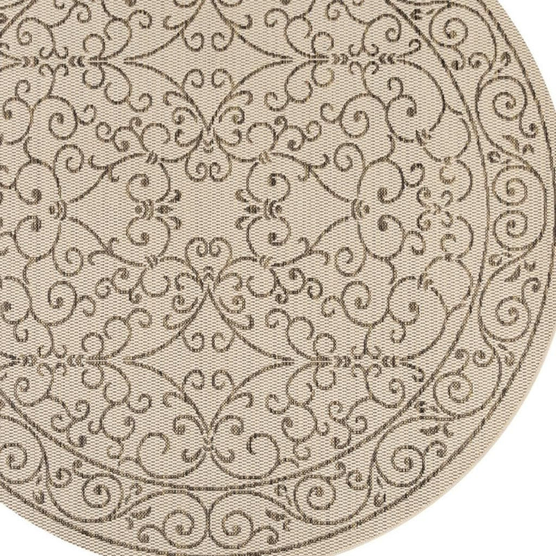 Round beige rug with brown floral scrollwork medallion and circular outer border
