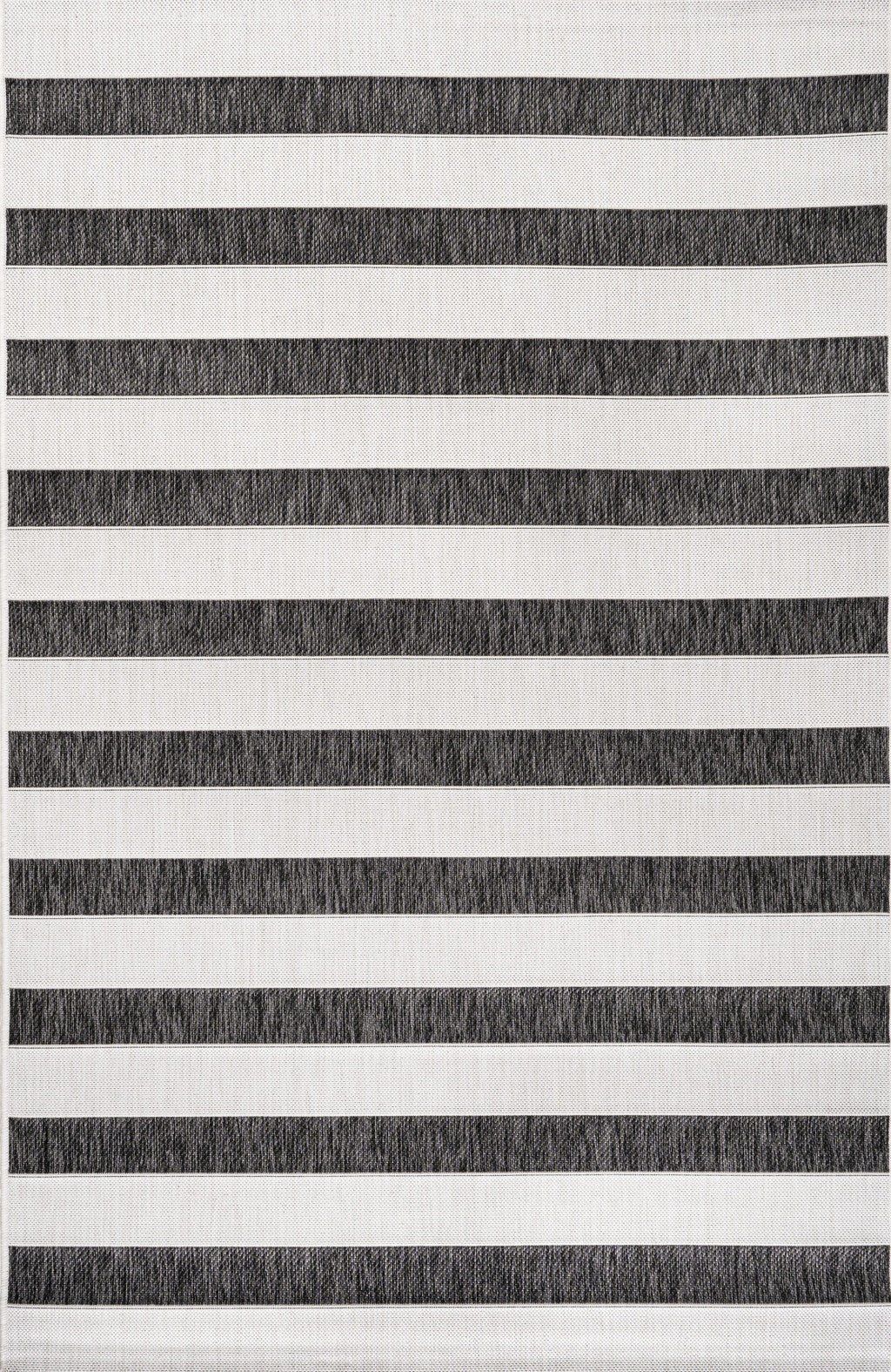 Striped area rug close-up with black and cream horizontal bands