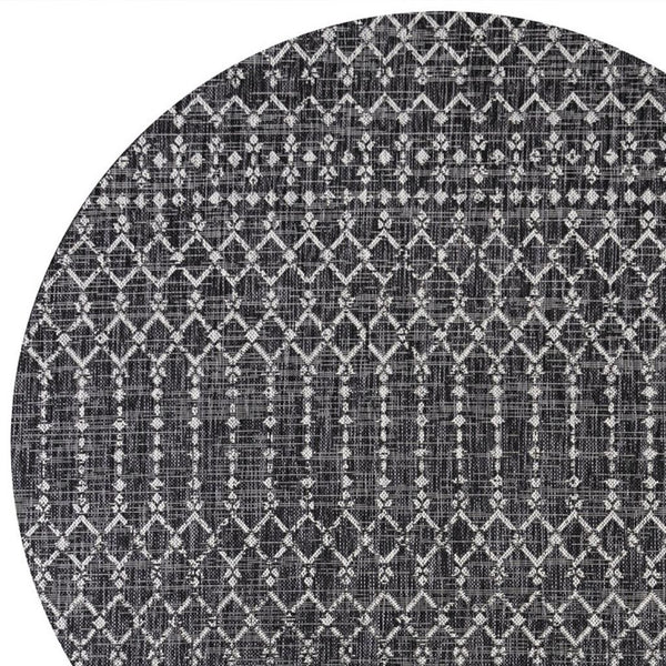 Round black and gray trellis area rug close view of repeating geometric rows