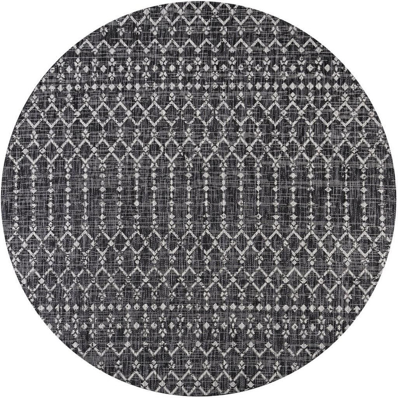 Round black and gray trellis area rug with repeating geometric pattern