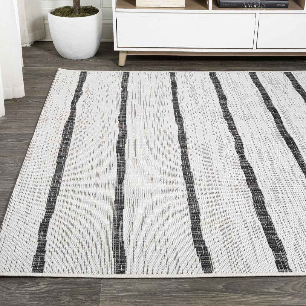 9' X 12' Ivory And Black Striped Indoor Outdoor Area Rug