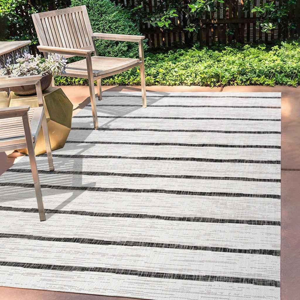 9' X 12' Ivory And Black Striped Indoor Outdoor Area Rug