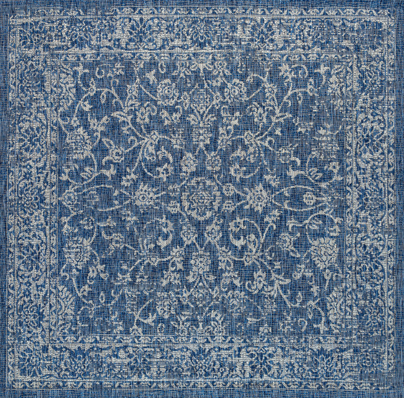 Square blue area rug with centered ivory medallion and detailed distressed border