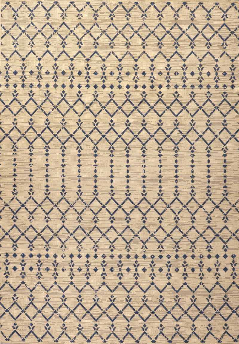 Beige rug close-up with navy trellis geometric diamonds and lines pattern