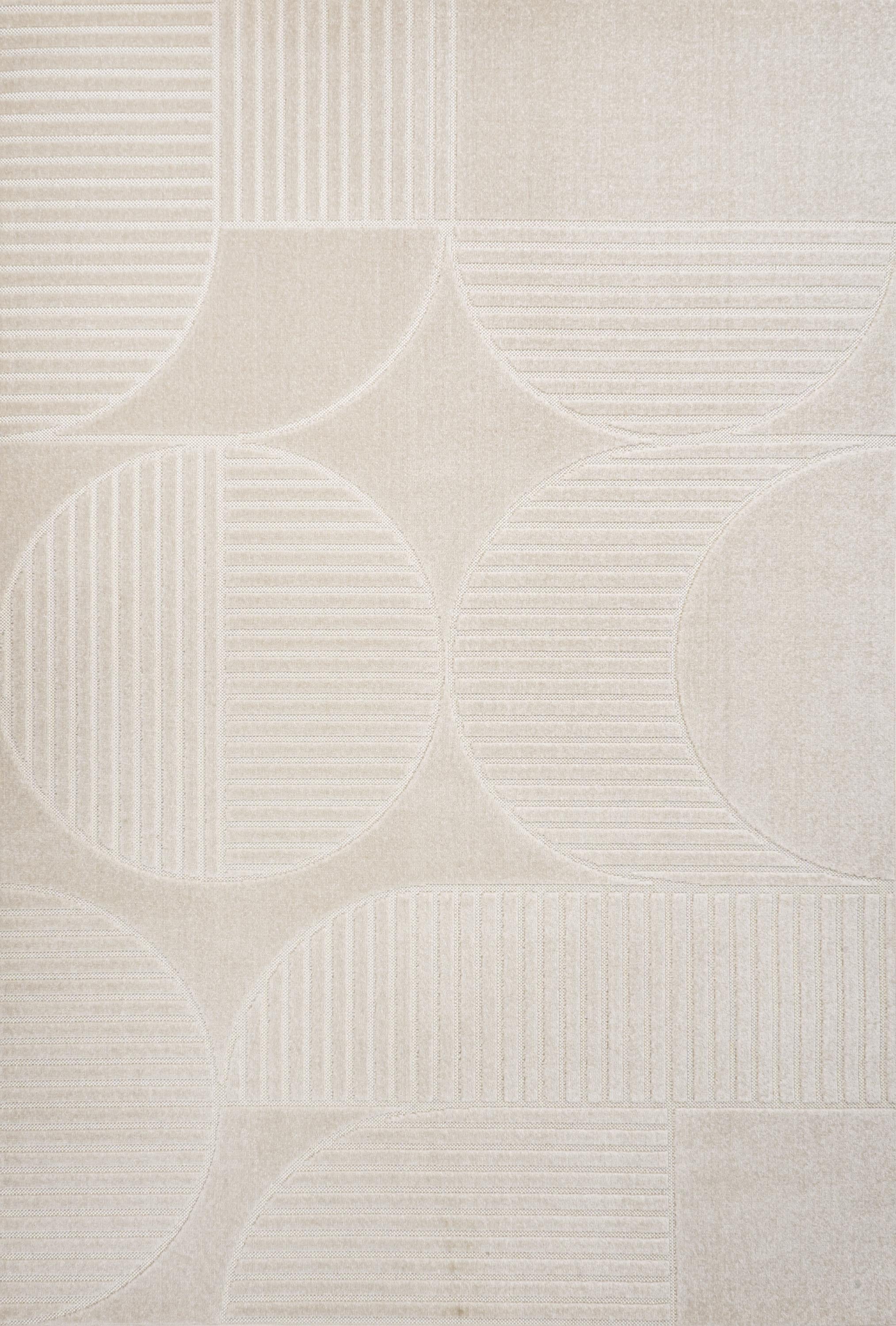 Ivory and cream area rug with raised geometric circles and stripe bands texture